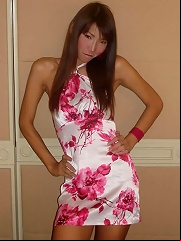 Slim ladyboy with feminine face teasing around